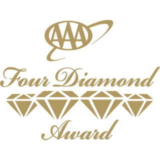 A gold logo featuring four diamond shapes with rays above, accompanied by a banner that reads “FOUR DIAMOND.”